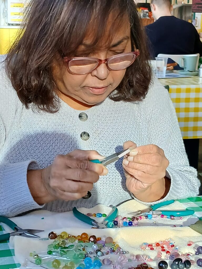Jewellery-making-with-women-and-colourful-beads